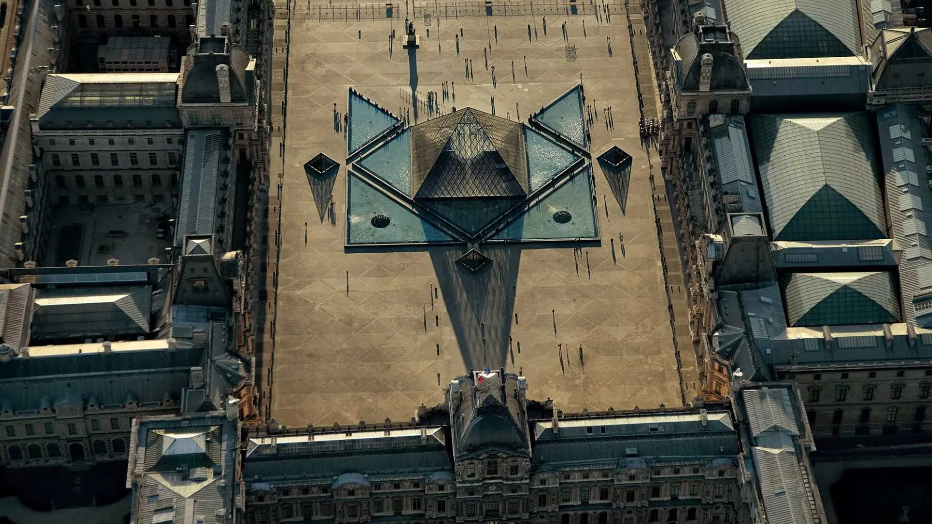 Helicopter view of the Louvre Pyramid durning the day.